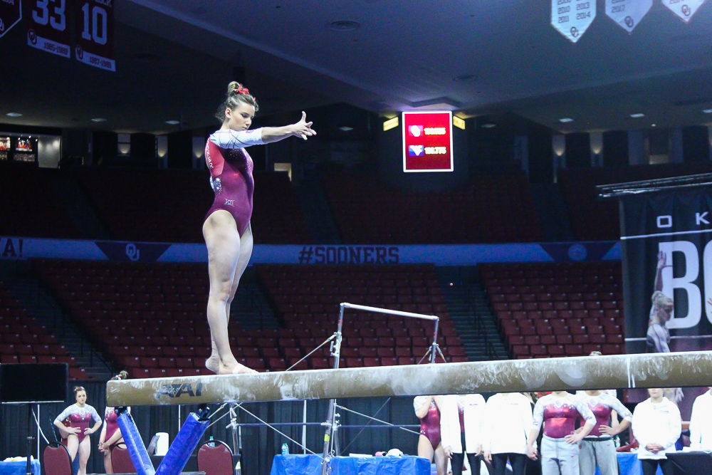 Freshman Anastasia Webb beam